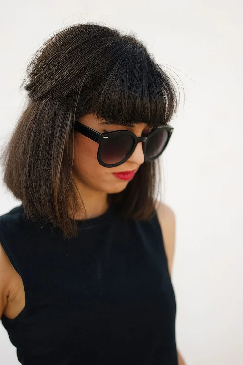 Photo showing dark brown bob and fringe, with the hairstyle clearly visible.