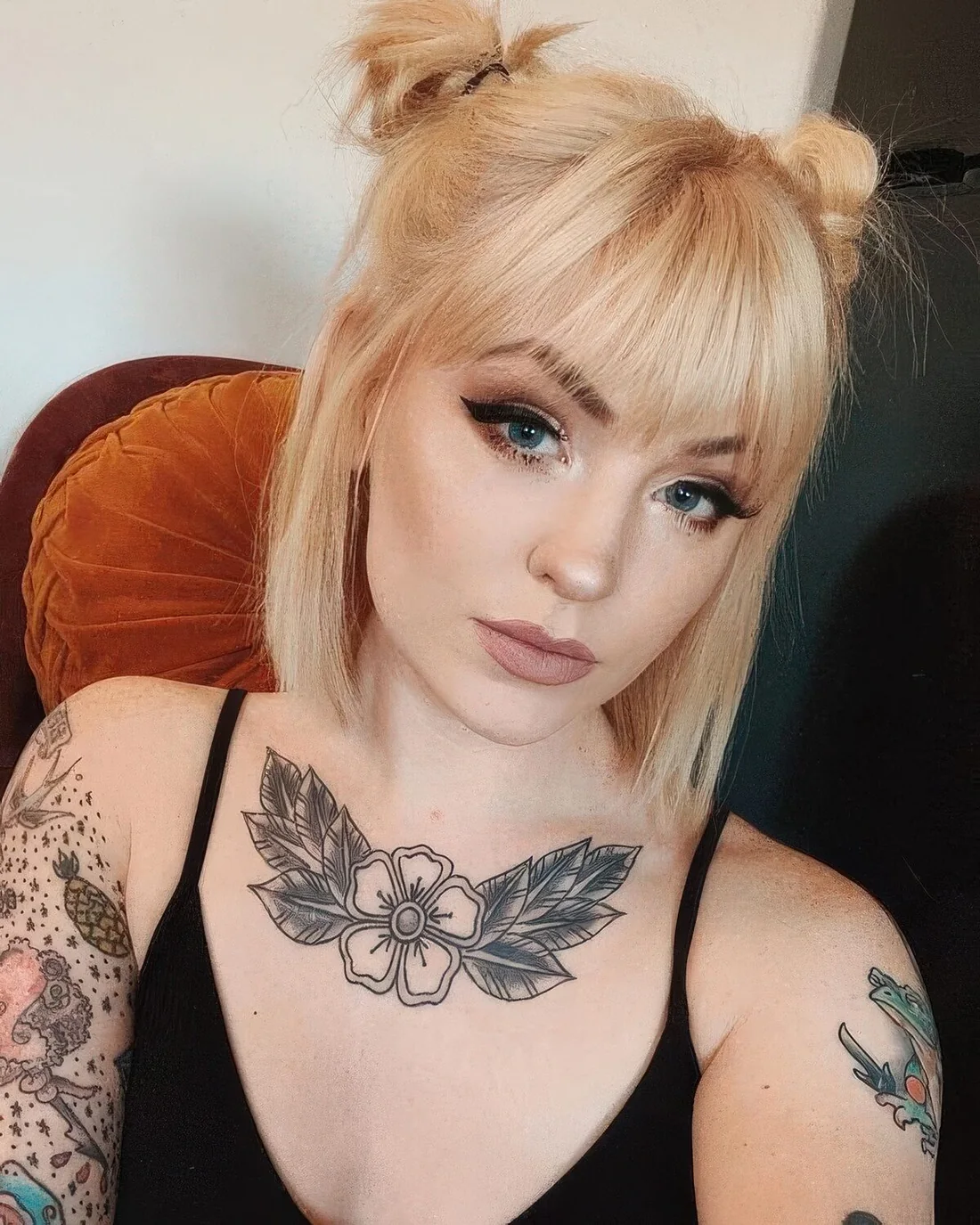 Photo showing warm blonde bob, with the hairstyle clearly visible.