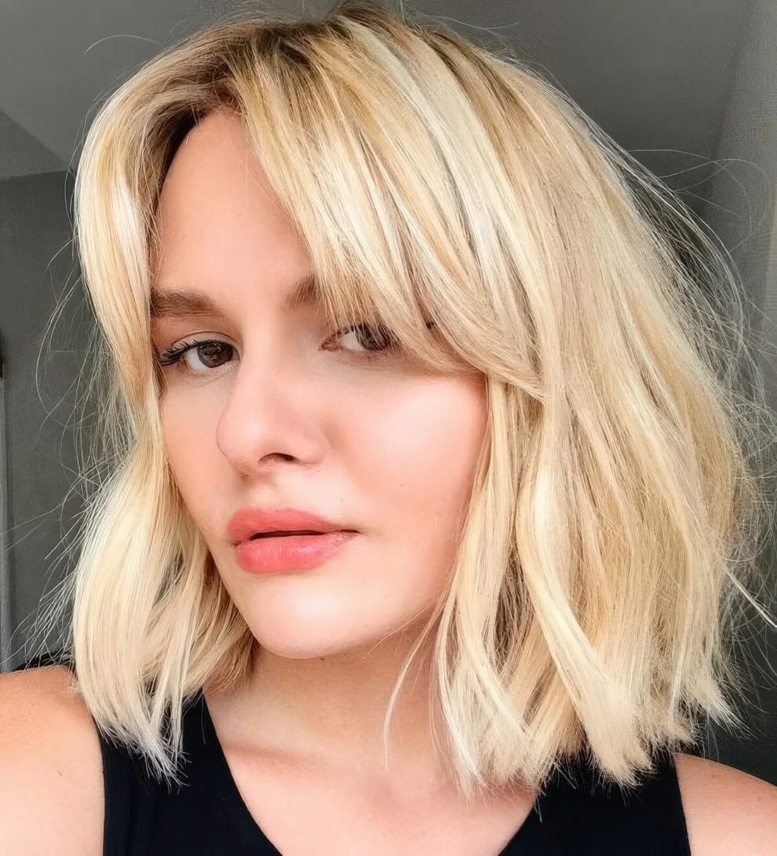 Messy and shaggy long bob wiht short curtain bangs.