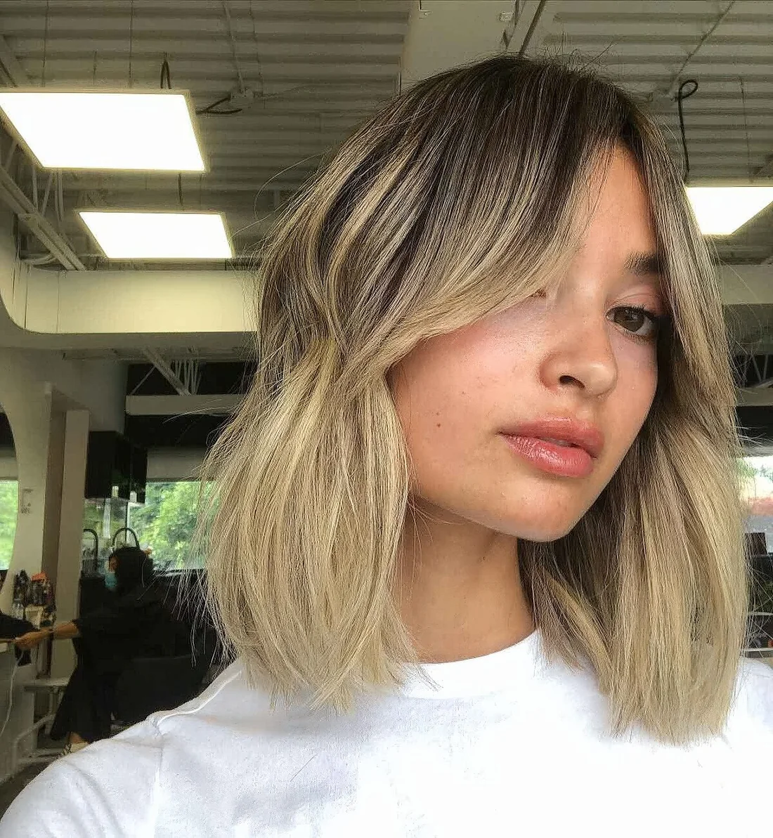 Photo showing haircut with a blonde balayage, with the hairstyle clearly visible.