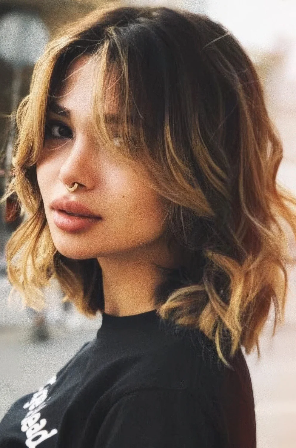 Photo showing medium layered haircut, with the hairstyle clearly visible.