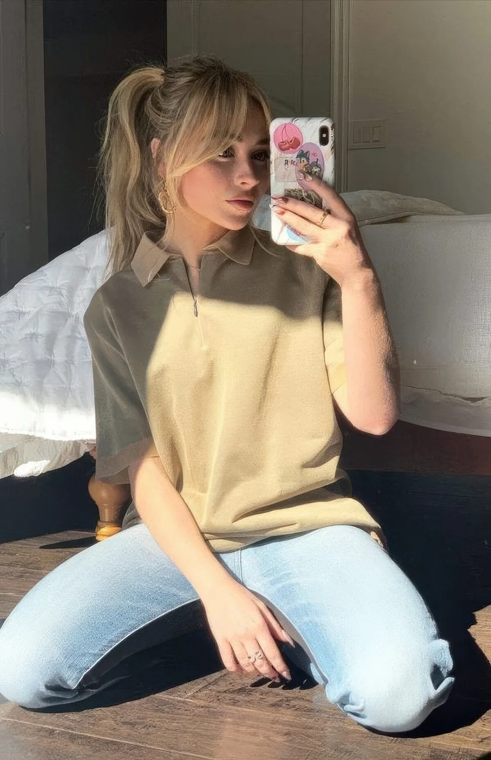 Photo showing messy ponytail hairstyle, with the hairstyle clearly visible.