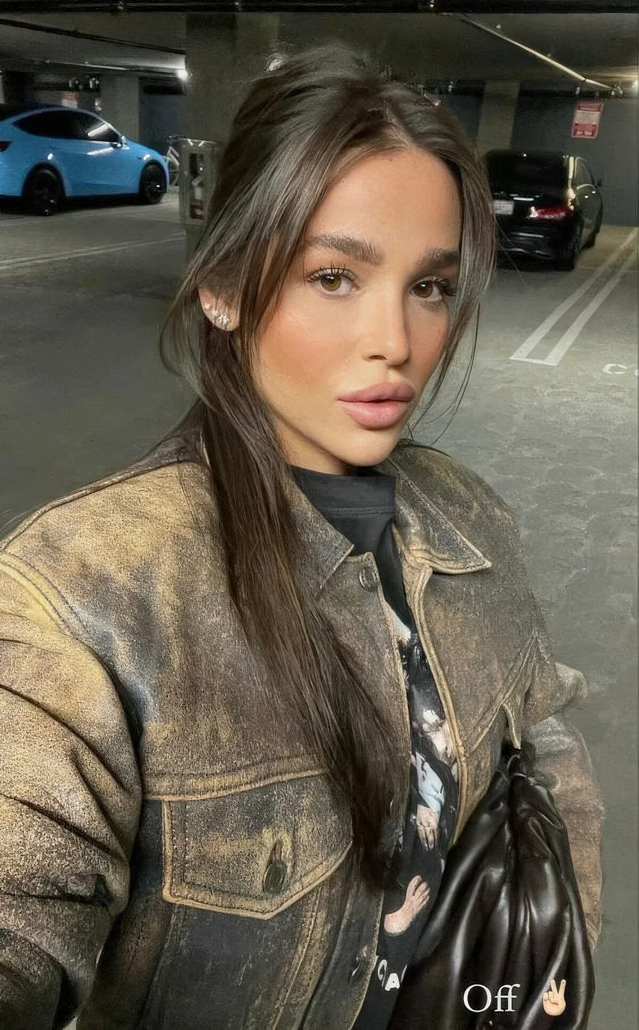 Long dark brown hair in a ponytail and long curtain bangs that beautifully frame the face are a very nice combo.