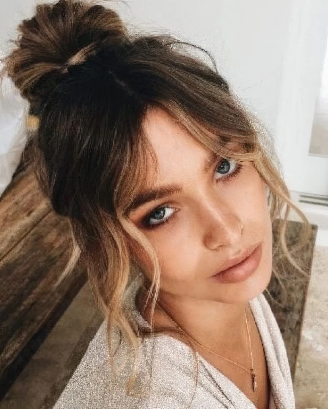 Wavy blonde parted curtain bangs are perfect for framing the face, whatever updo or other hairstyle you are wearing.