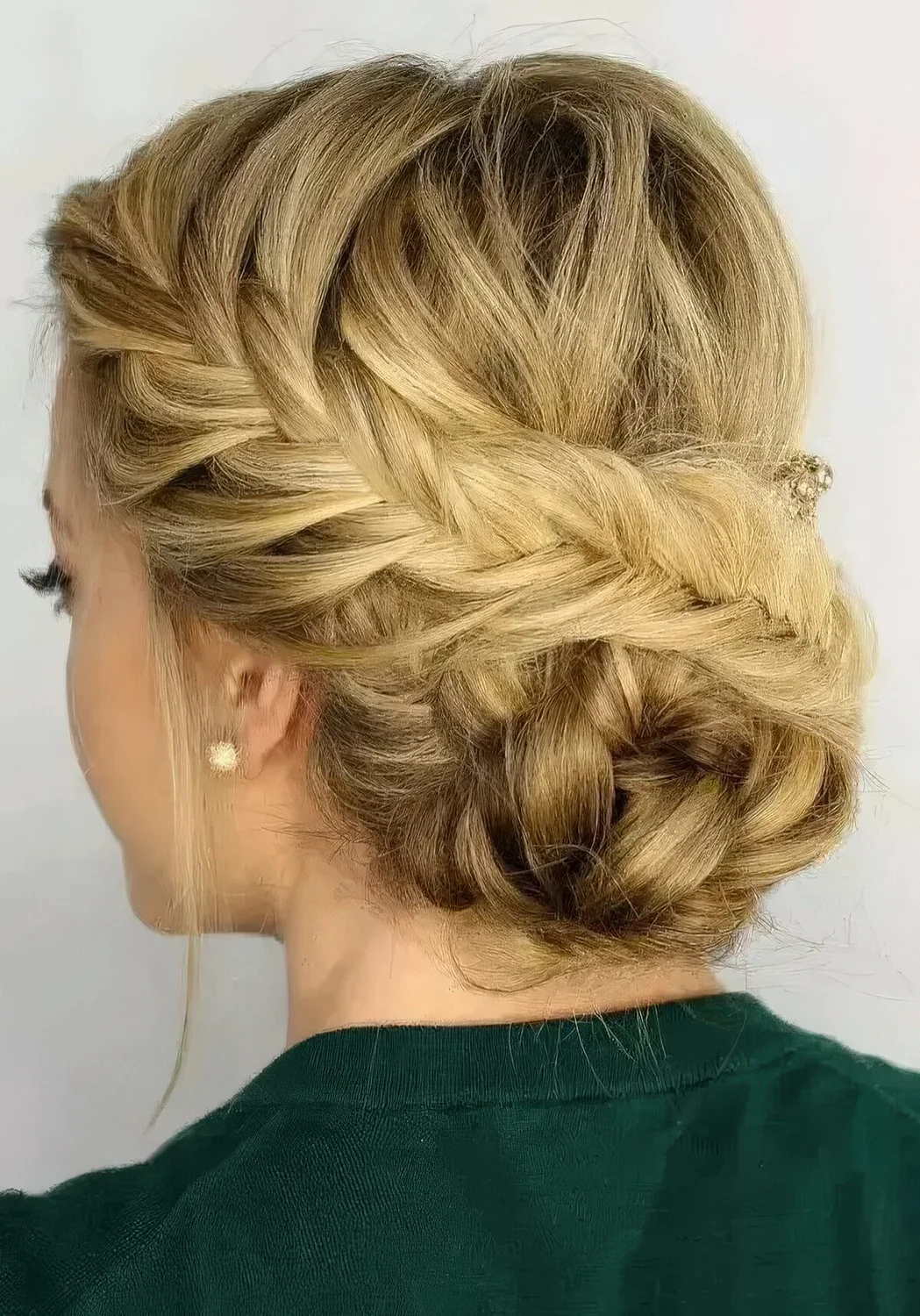 Fishtail side braided updo with a braided bun and some locks down.