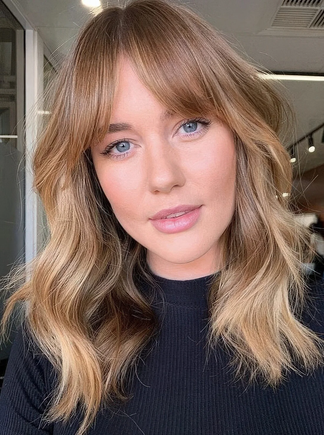 Photo showing long layered hairstyle, with the hairstyle clearly visible.
