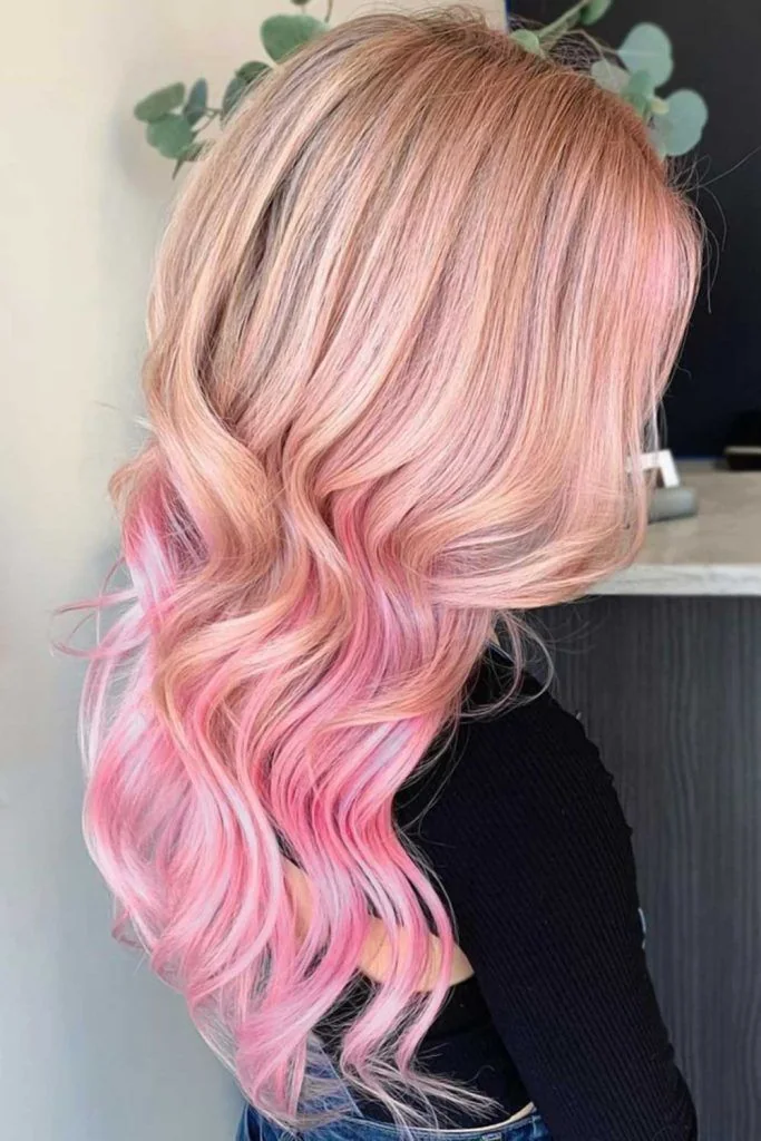 Photo showing long Pink-Blonde Waves, with the hairstyle clearly visible.