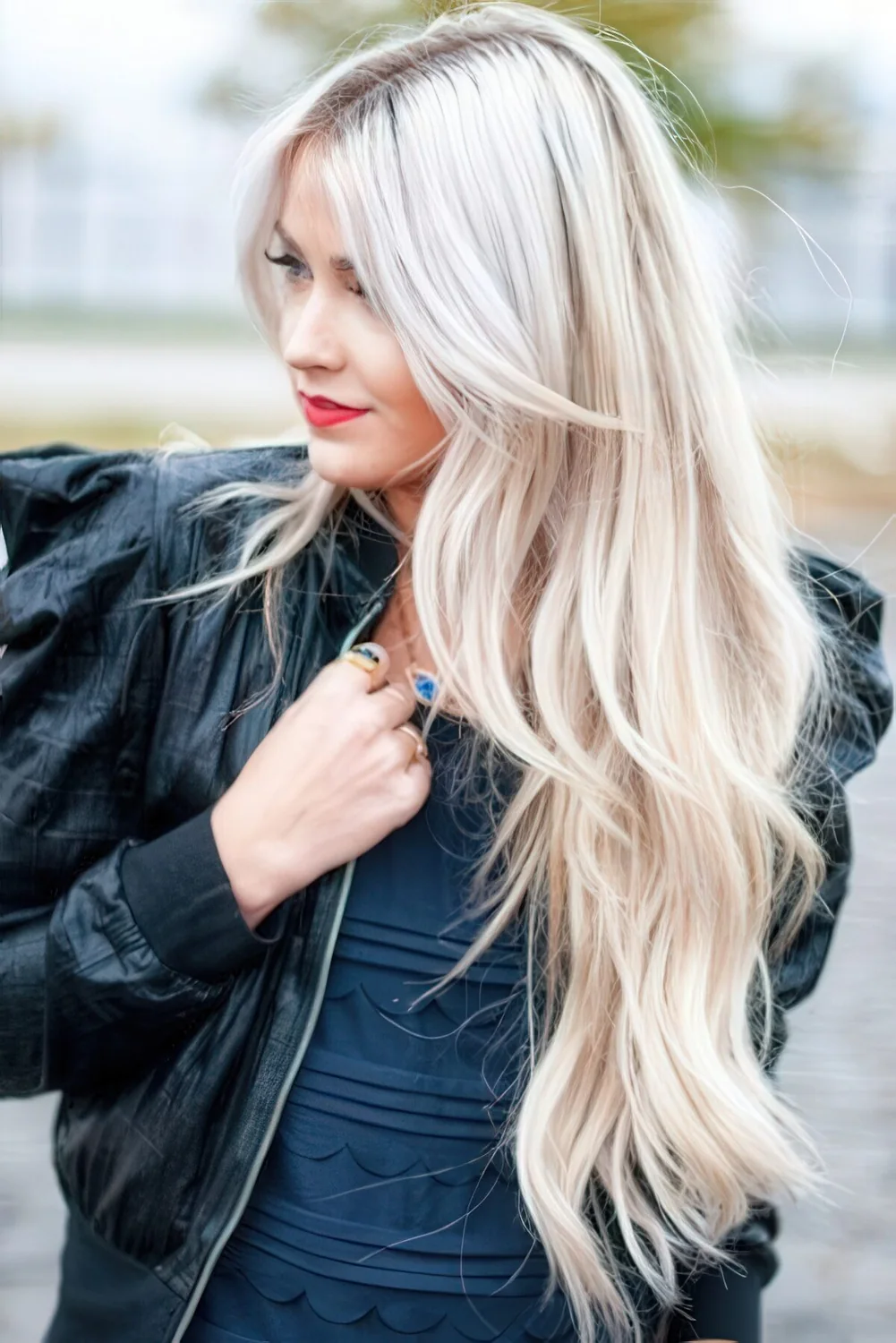 Long layered haircut on blonde hair.