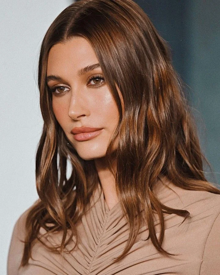 Photo showing wavy hair down, with the hairstyle clearly visible.