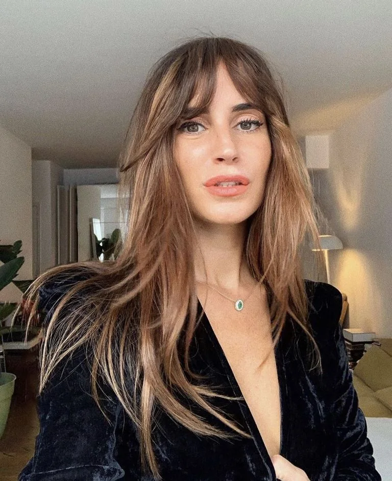 Photo showing hair down and bangs, with the hairstyle clearly visible.