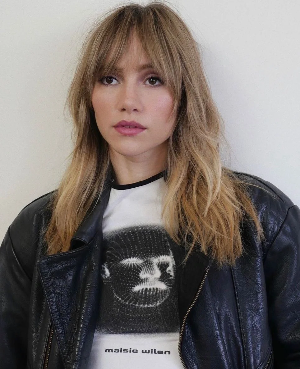 Photo showing shaggy cut with bangs, with the hairstyle clearly visible.