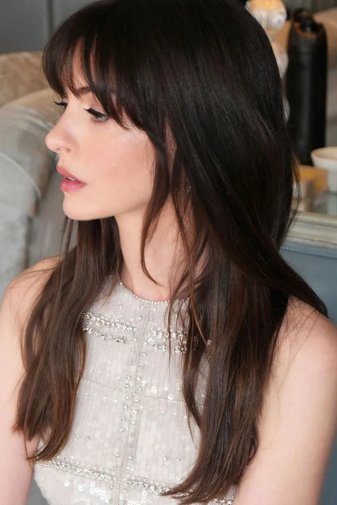 Photo showing layered hair and bangs, with the hairstyle clearly visible.