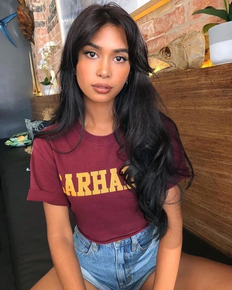 Photo showing layered long cut, with the hairstyle clearly visible.