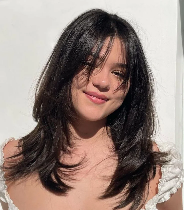 Photo showing butterfly with bangs, with the hairstyle clearly visible.