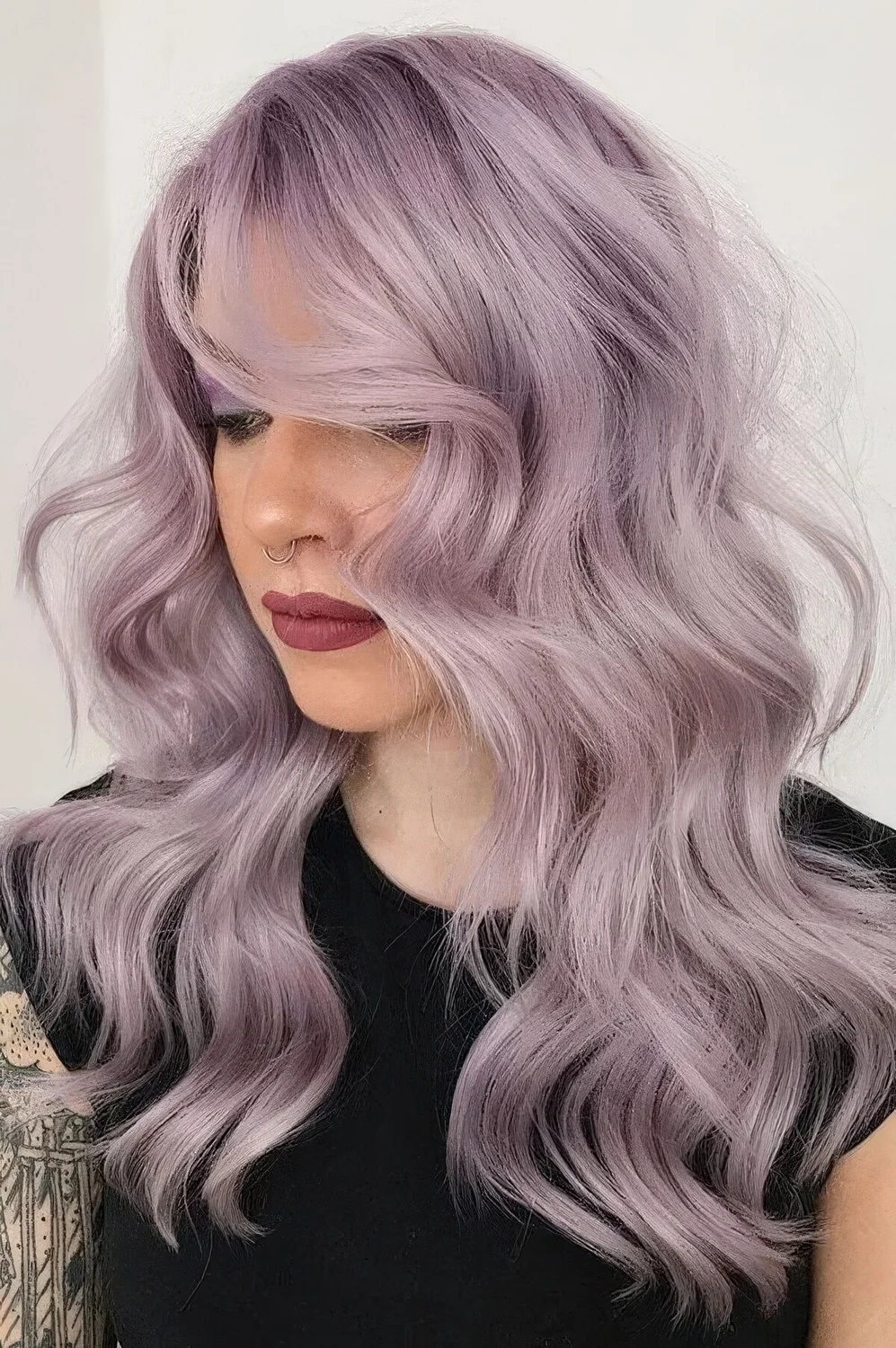 Pale lavender hair with a lot of volume and waves loosk decadent and very chic, this cold shade compliments the face features.