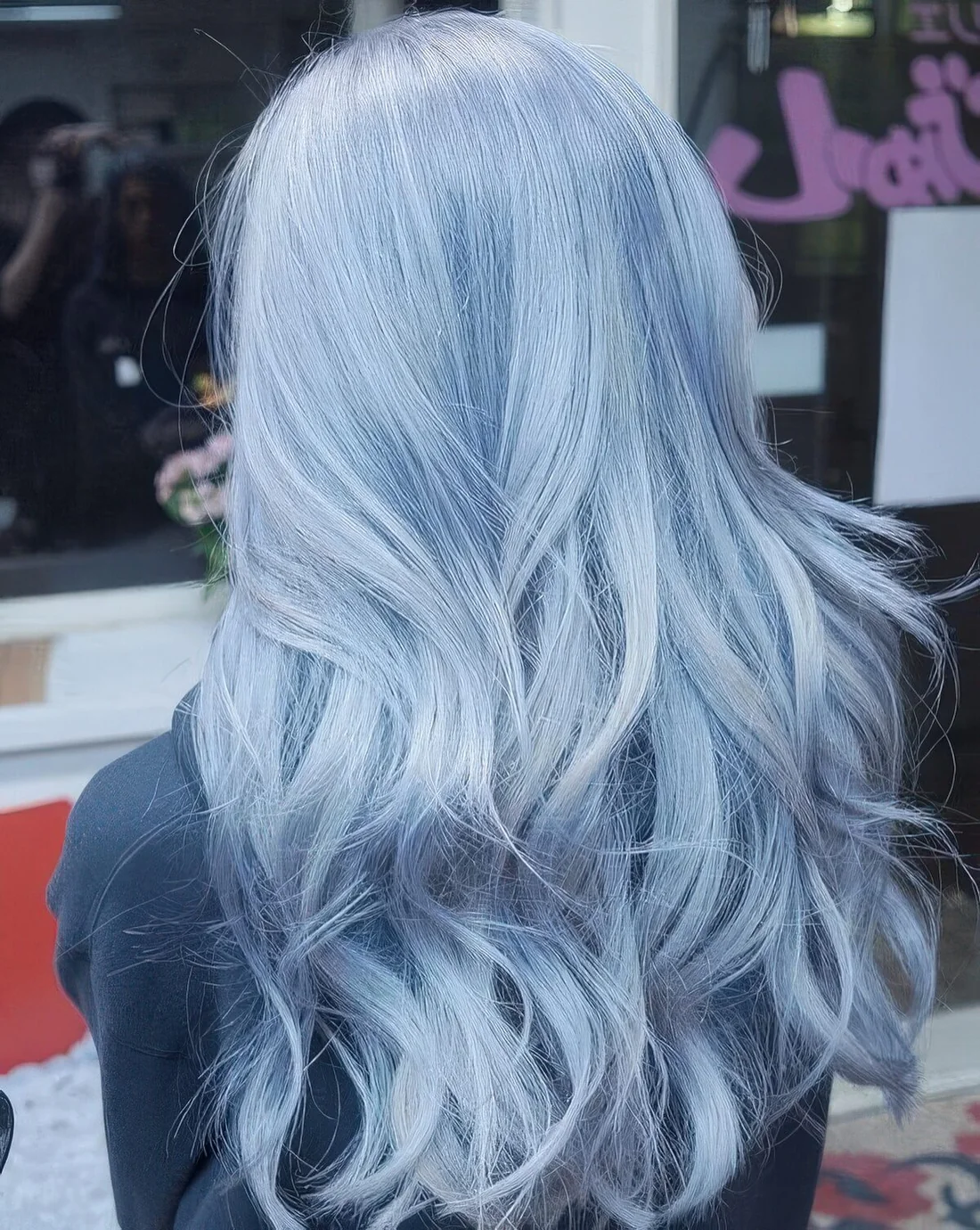Long pastel blue hair with a bit of waves.