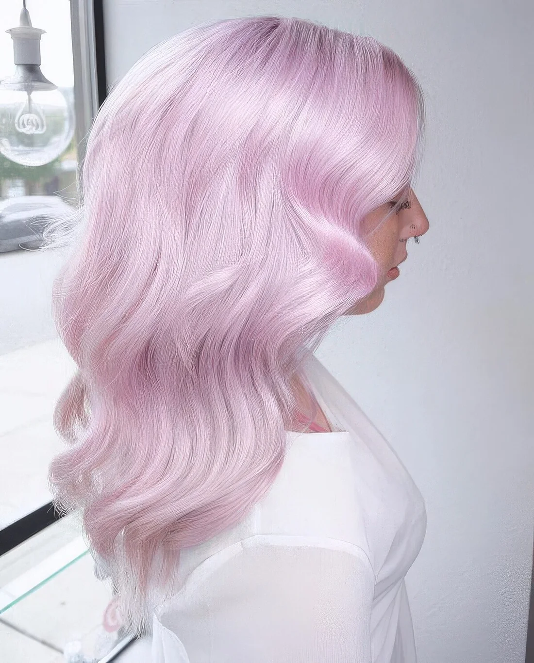 Jaw dropping silver pink hair with a lot of volume and some waves.