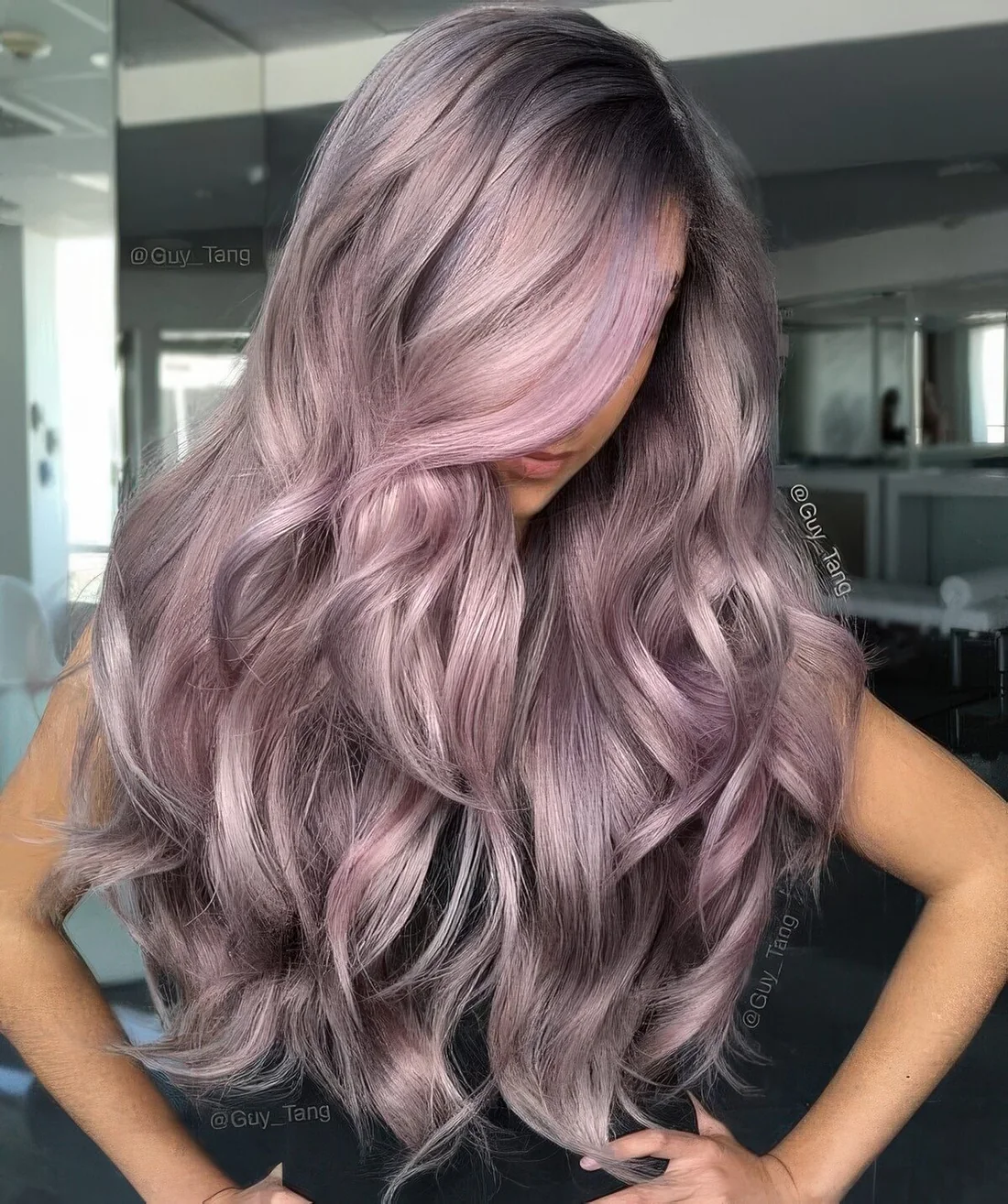 Long lilac and mauve hair with waves and a bit of volume.
