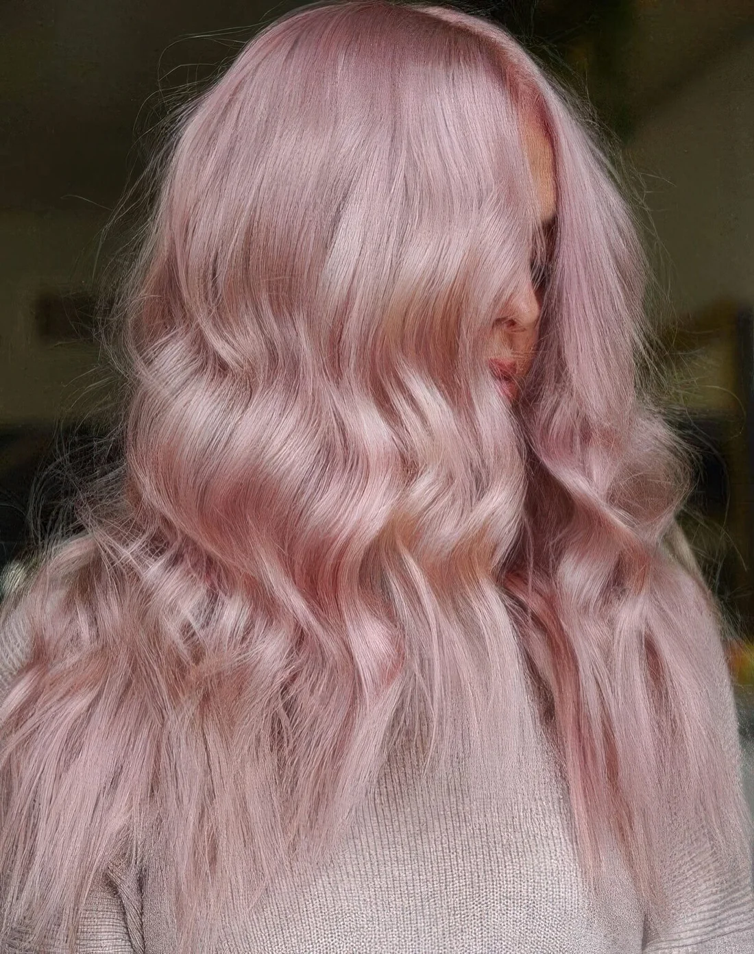 Long pastel pink hair with a touch of texture and a bit of waves are a lovely and very romantic combination.