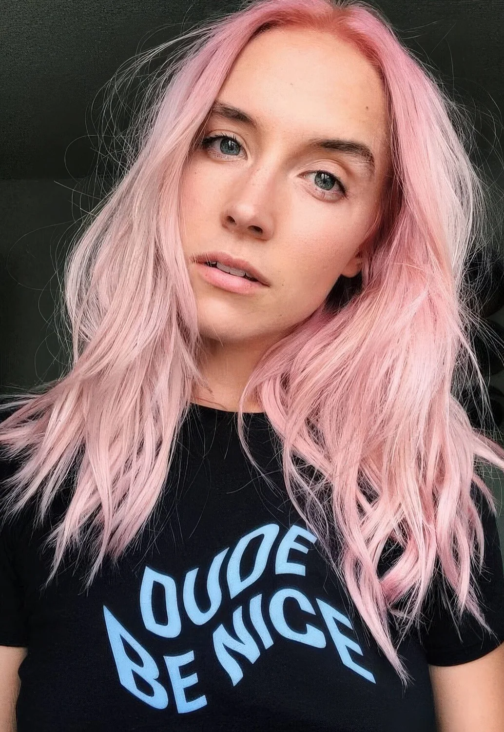 Photo showing long pastel pink hair with layers, with the hairstyle clearly visible.