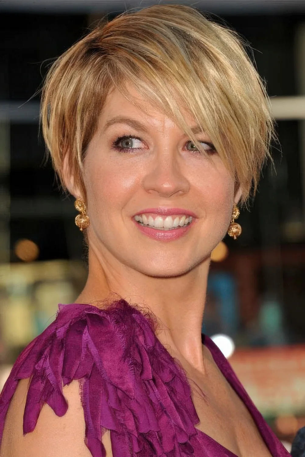 Side parted pixie has a very effortless appearance, short layers flattering the face and the balayage.