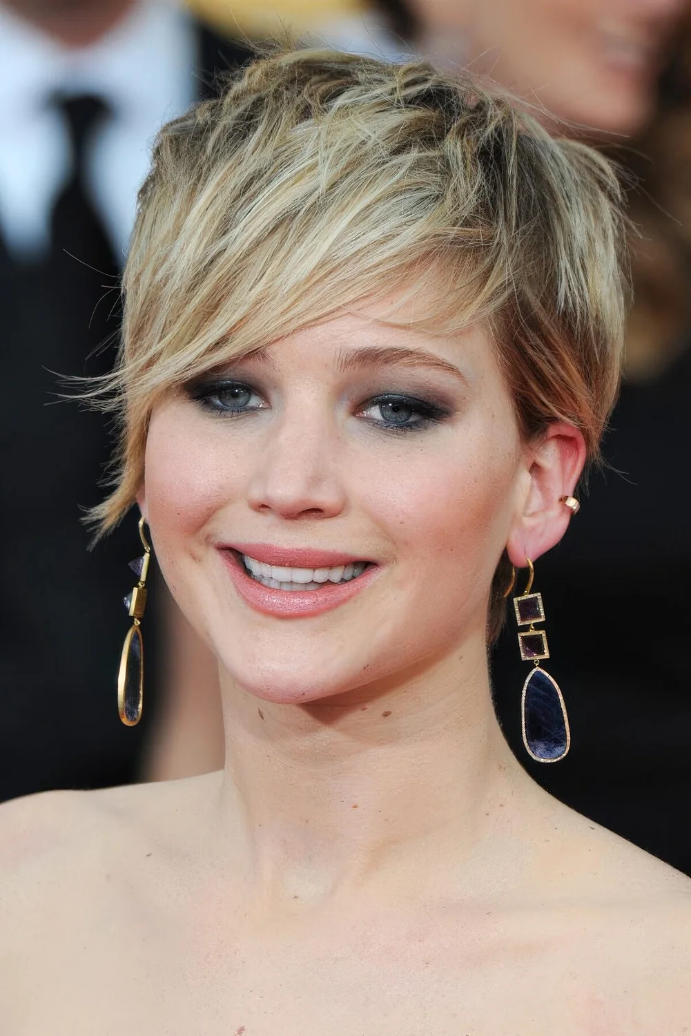 Jennifer Lawrence rocking a long blonde pixie that perfectly follows her face shape and.