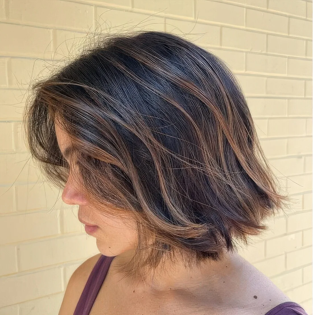Dark textural bob with caramel balayage and babylights.
