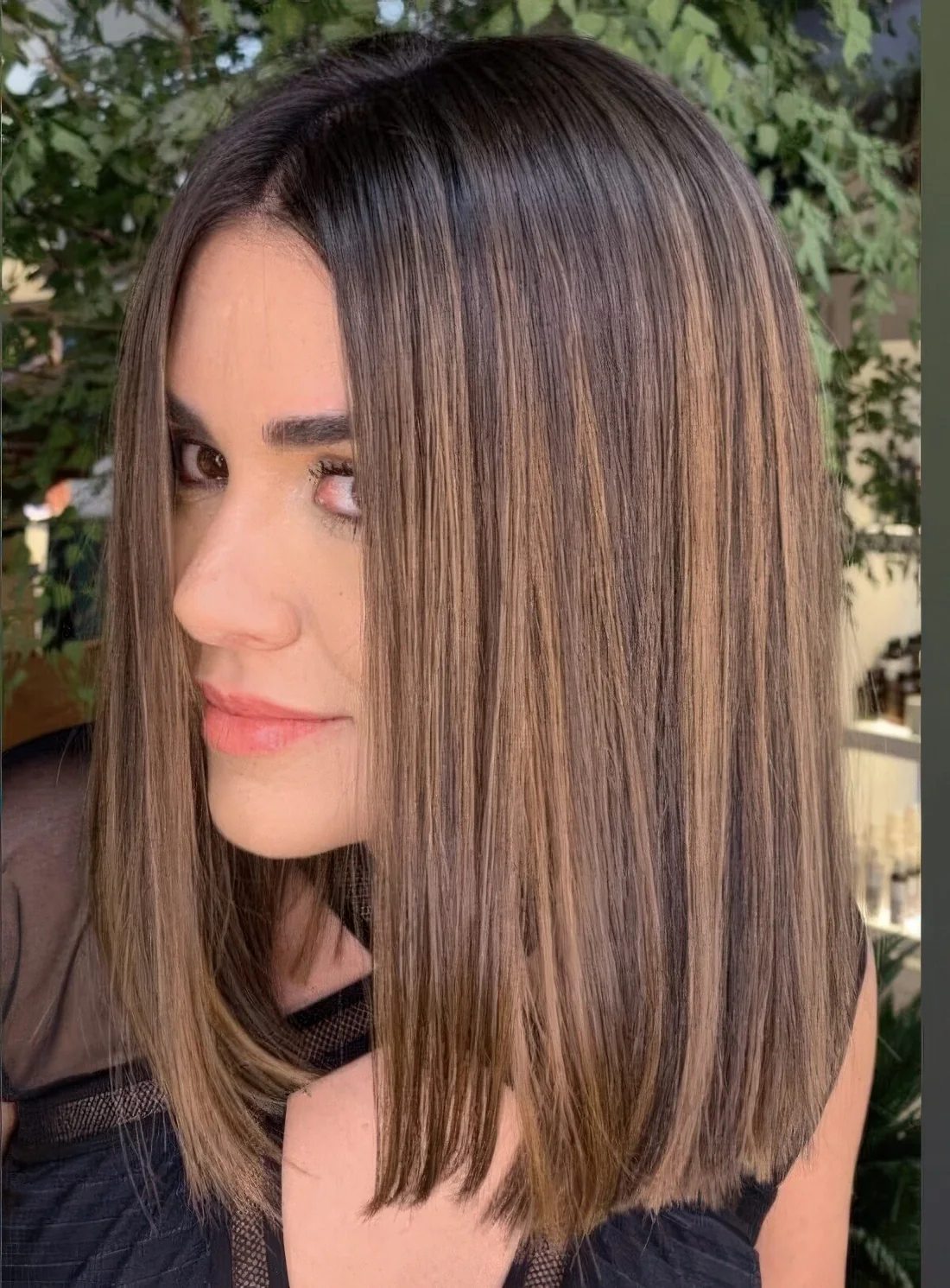 Dark brunette hair with beautiful caramel balayage and babylights.