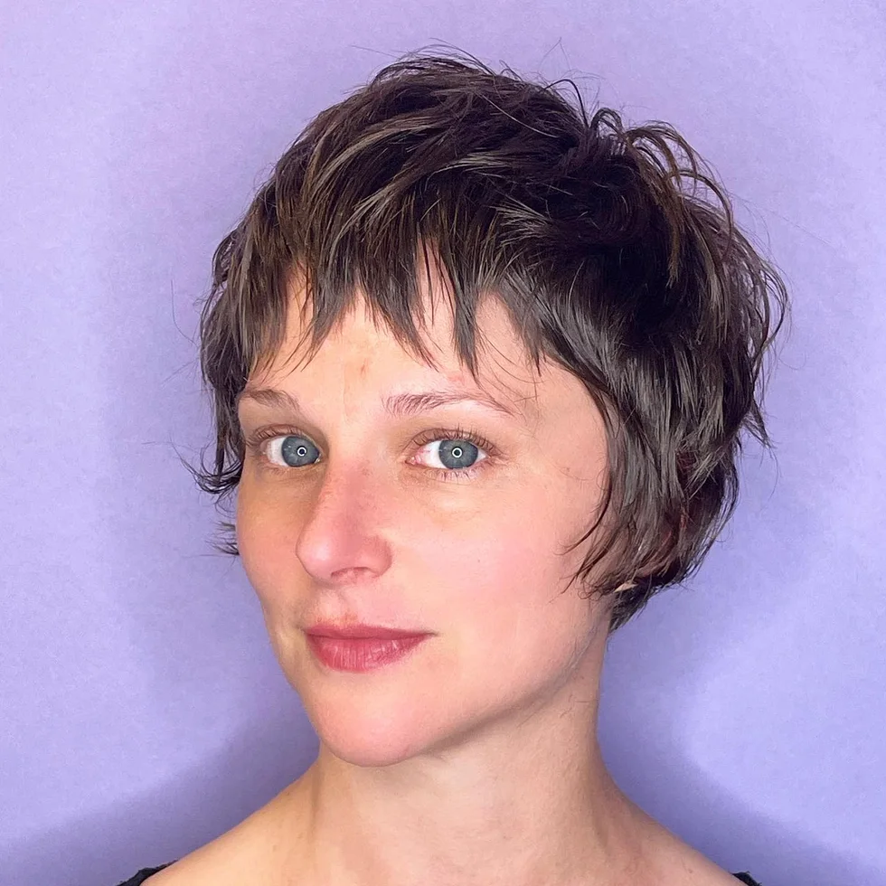 ear straight chestnut pixie with side swept fringe shown as a low maintenance haircuts for fine hair idea, featuring textured finish