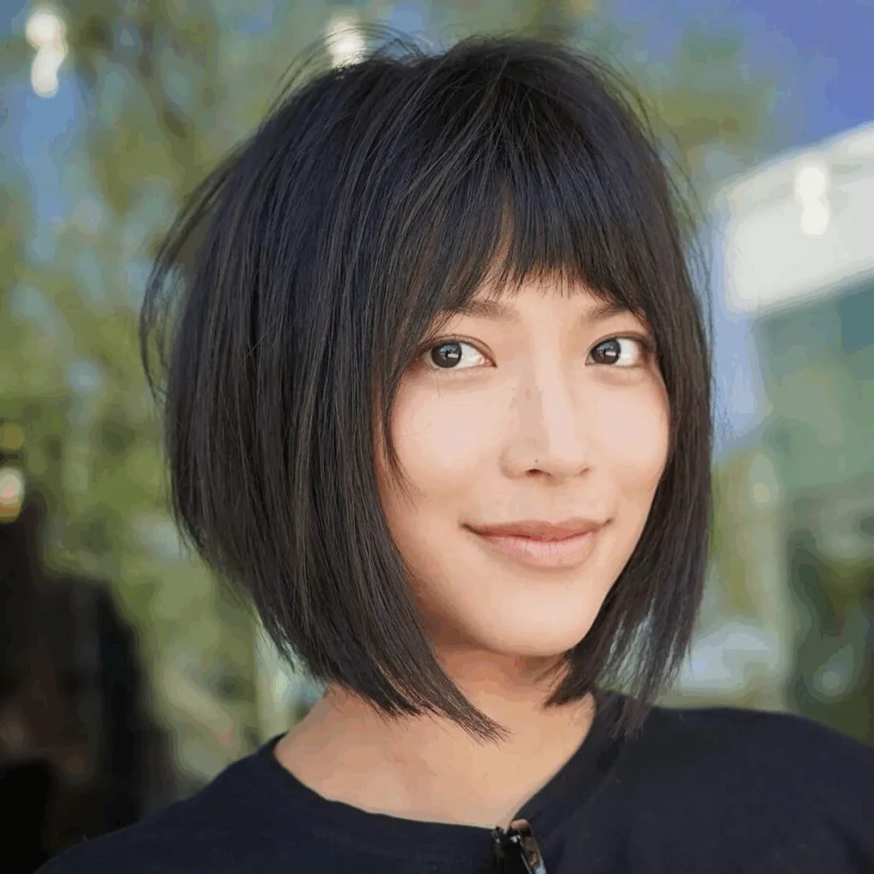 chin straight chestnut bob shown as a low maintenance haircuts for fine hair idea, featuring chin outline, shown in wispy bob with light bangs