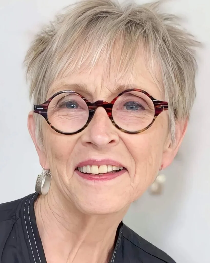 ear straight silver pixie with side swept fringe shown as a low maintenance hairstyles for 60 year old woman with fine hair idea