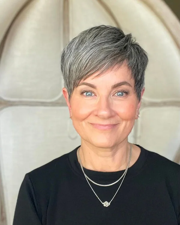 ear straight chestnut pixie with side swept fringe shown as a low maintenance hairstyles for 60 year old woman with fine hair idea