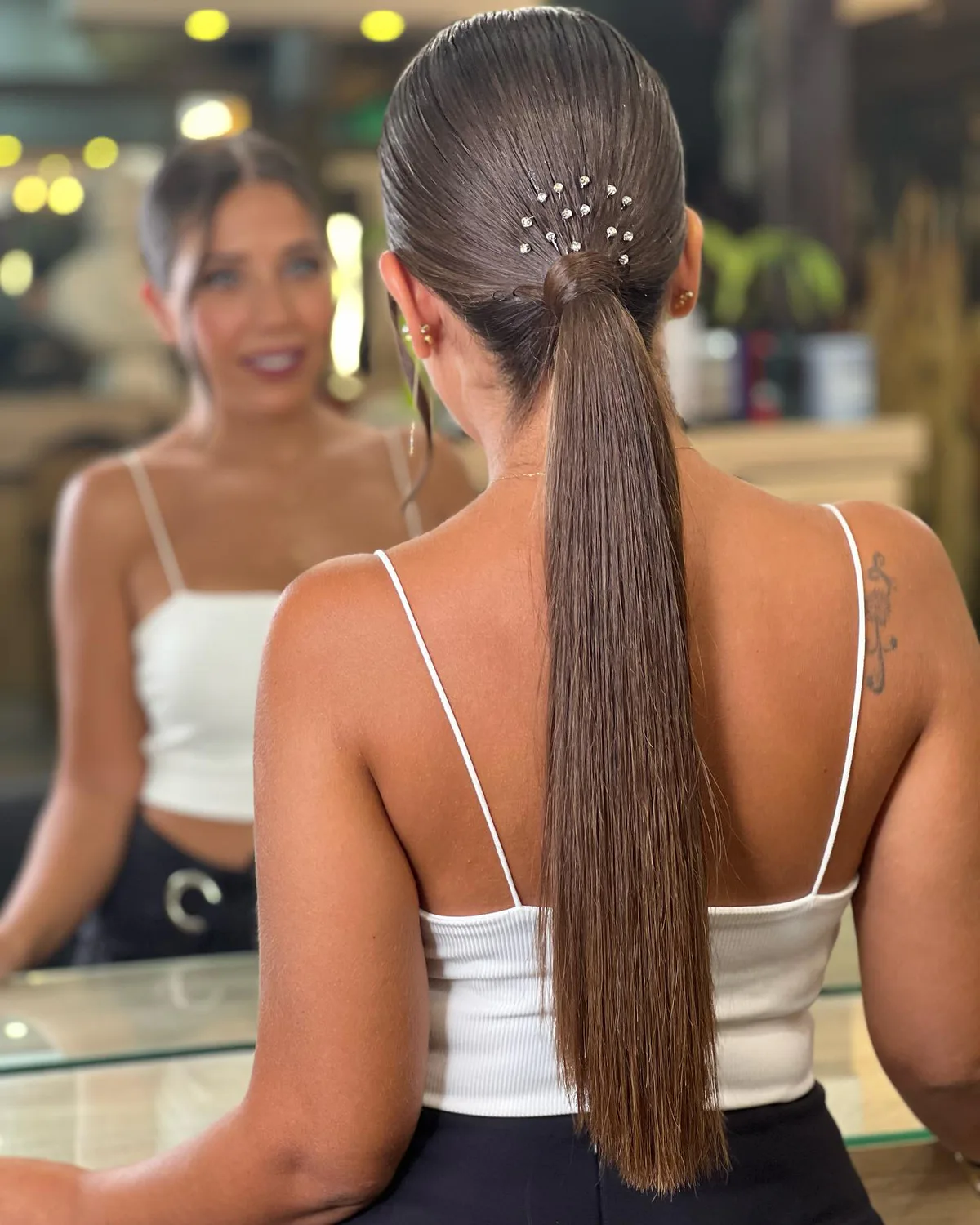 chest straight brunette ponytail shown as a low ponytail hairstyles idea