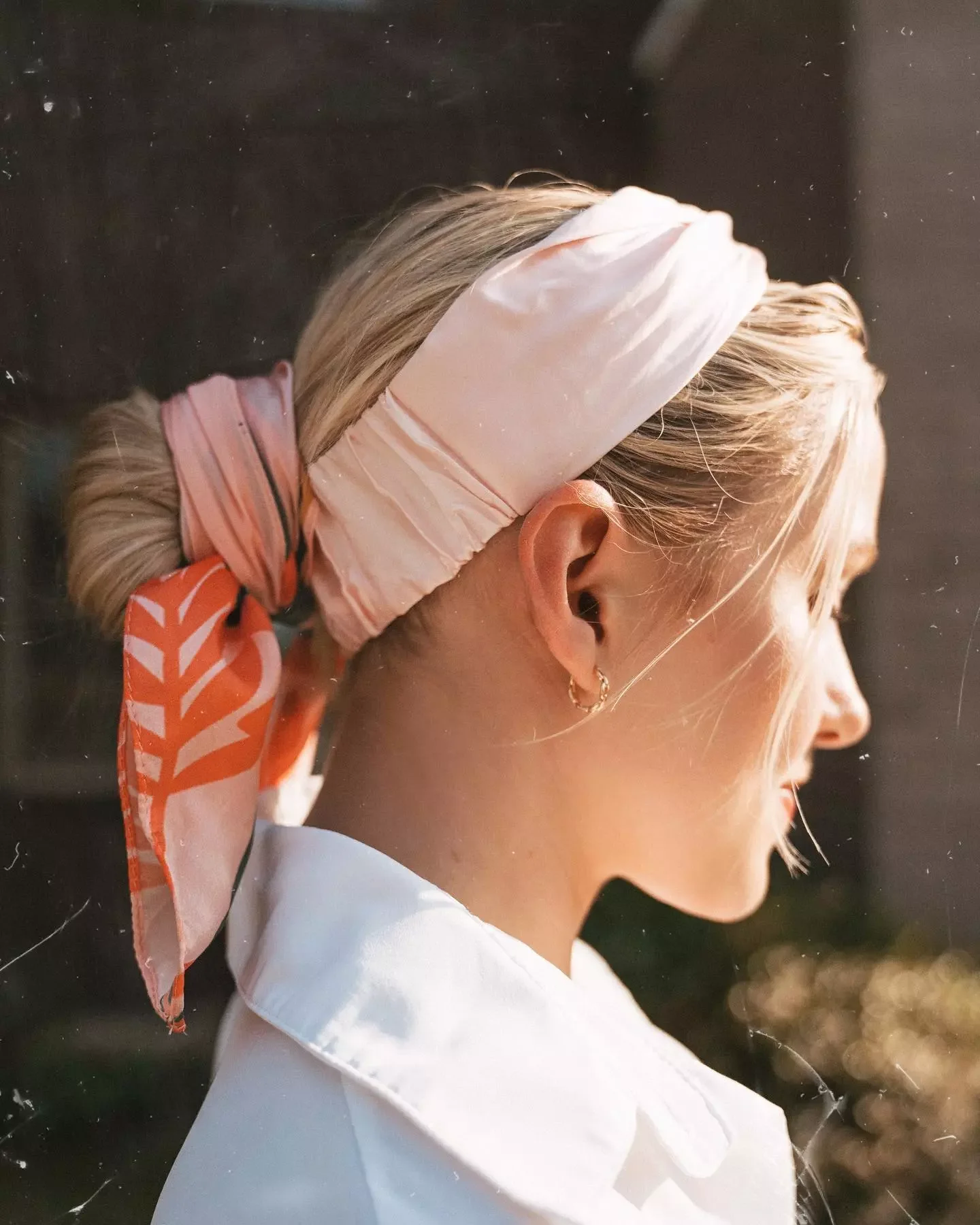 chest curly blonde updo shown as a low ponytail hairstyles idea