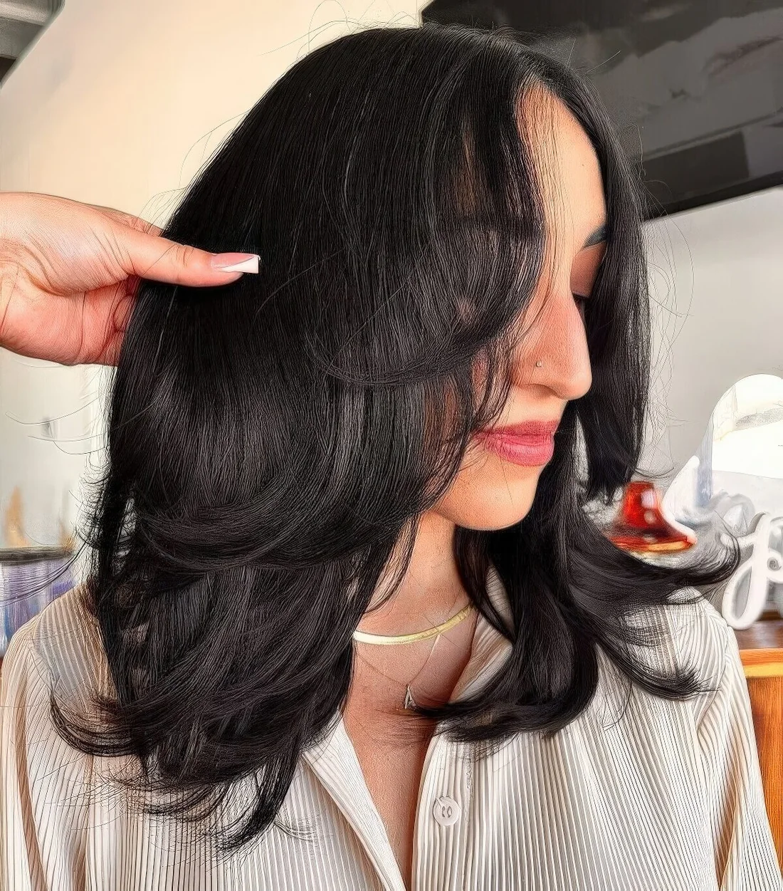 Black medium butterfly haircut with curled ends.
