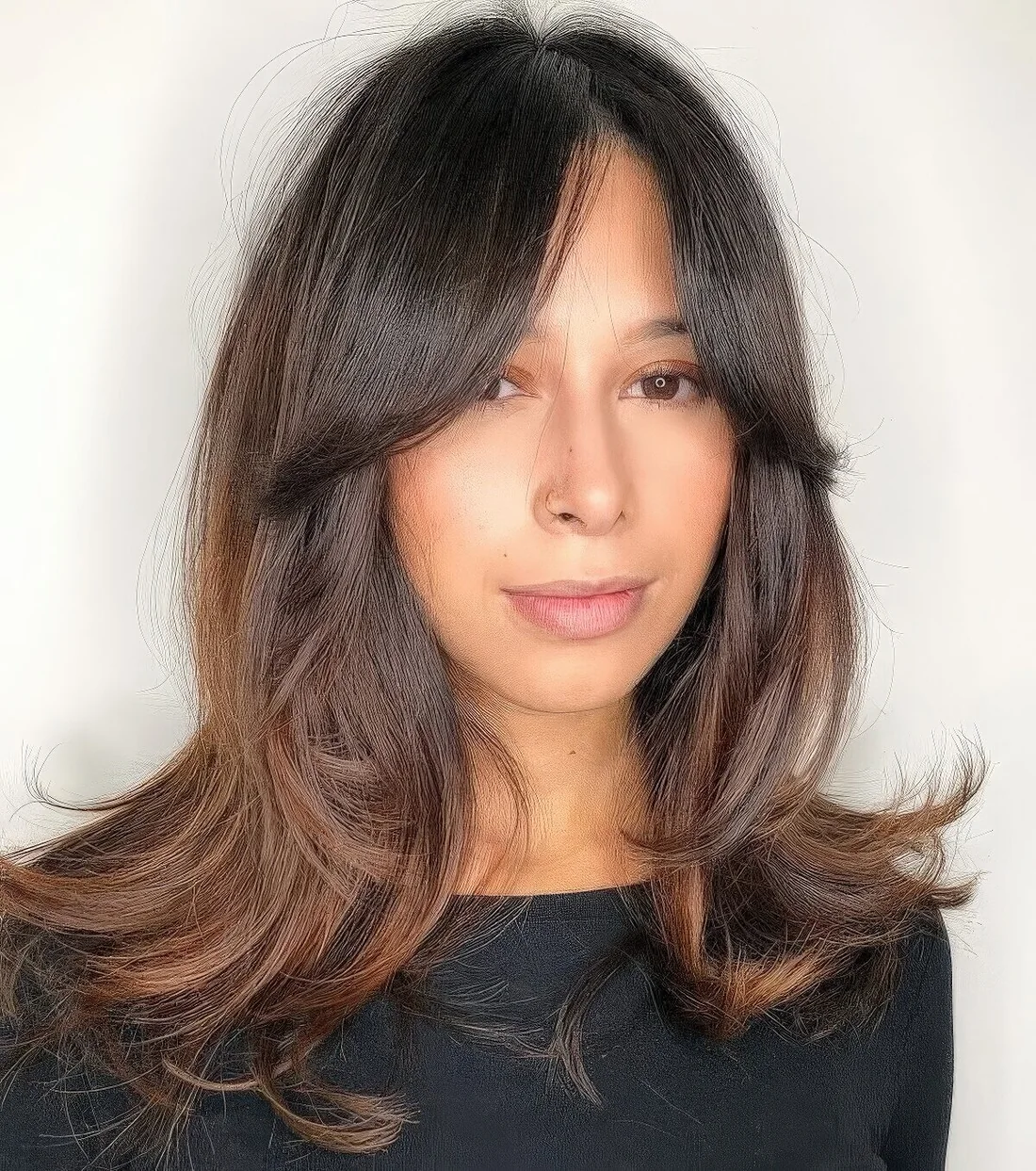 Photo showing hairstyle with a caramel balayage, with the hairstyle clearly visible.