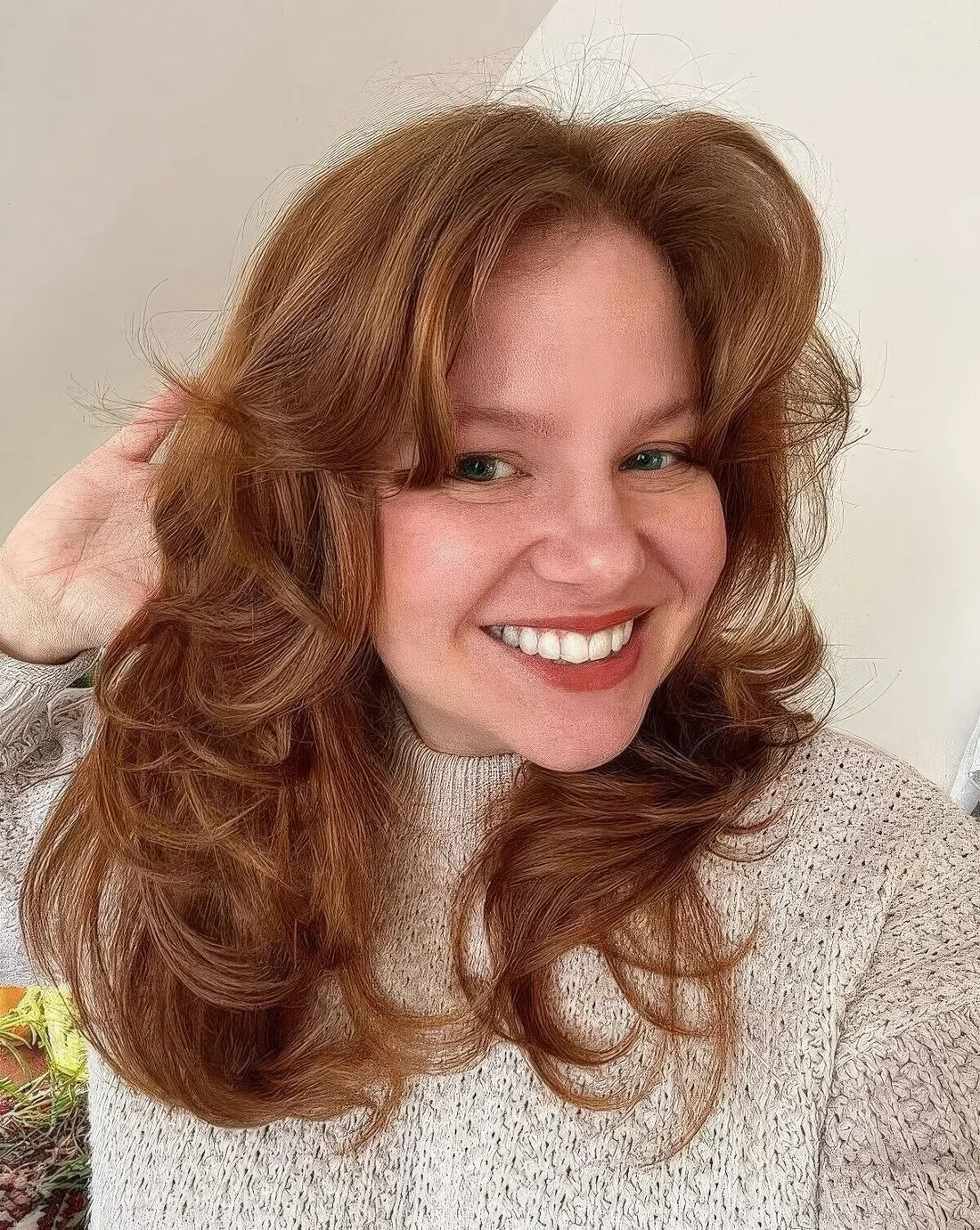 Photo showing ginger butterfly haircut, with the hairstyle clearly visible.