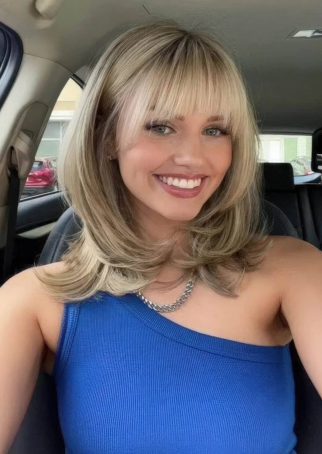 Photo showing hairstyle with blunt bangs, with the hairstyle clearly visible.
