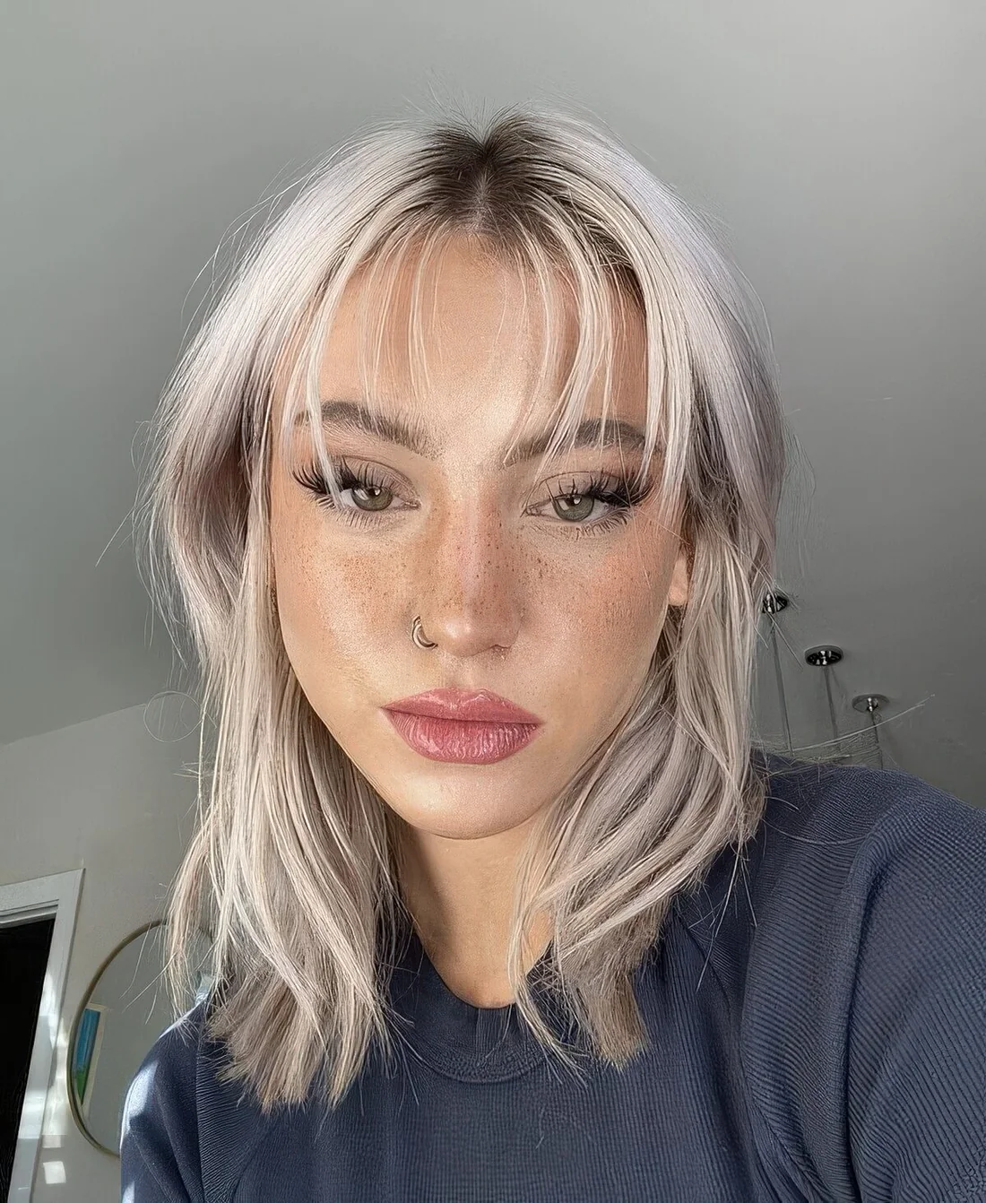 Photo showing hairstyle with a touch of pink, with the hairstyle clearly visible.