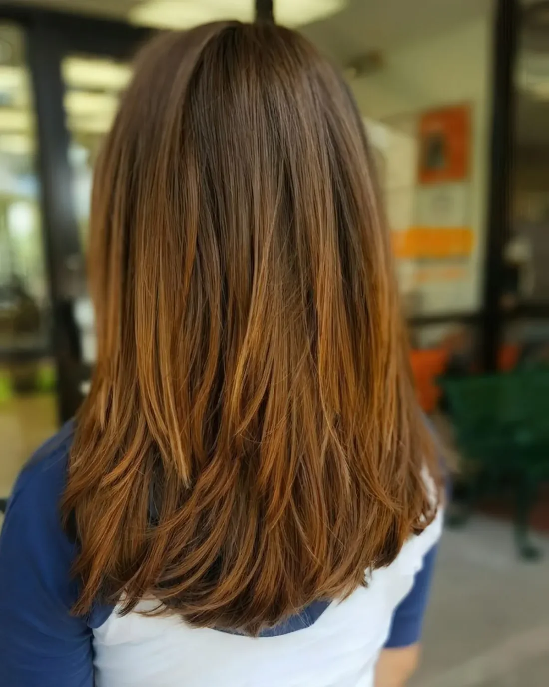 Chic medium layered haircut with ombre detailing for more texture and interest.