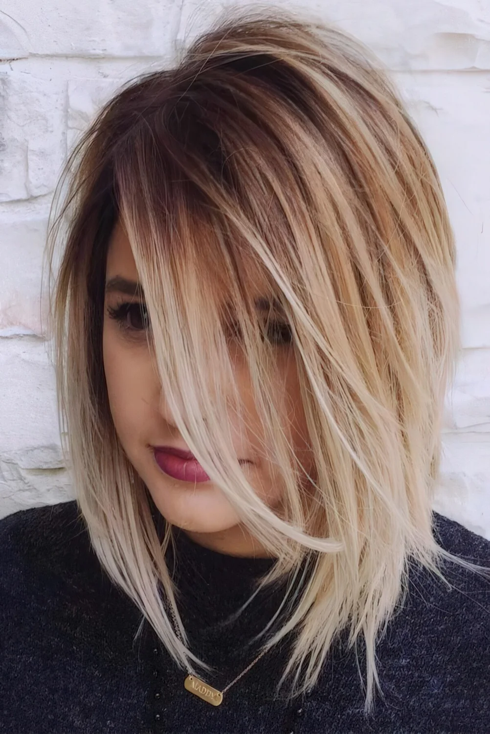 Photo showing bob hairstyle with a layered look, with the hairstyle clearly visible.