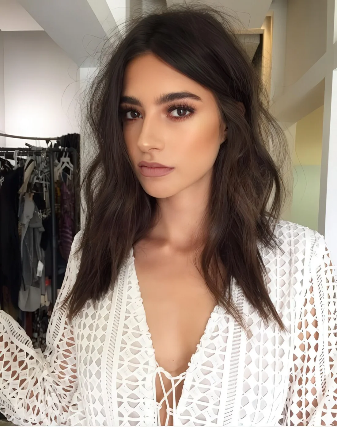 Medium-length hair with layers and a bit of grungy look.