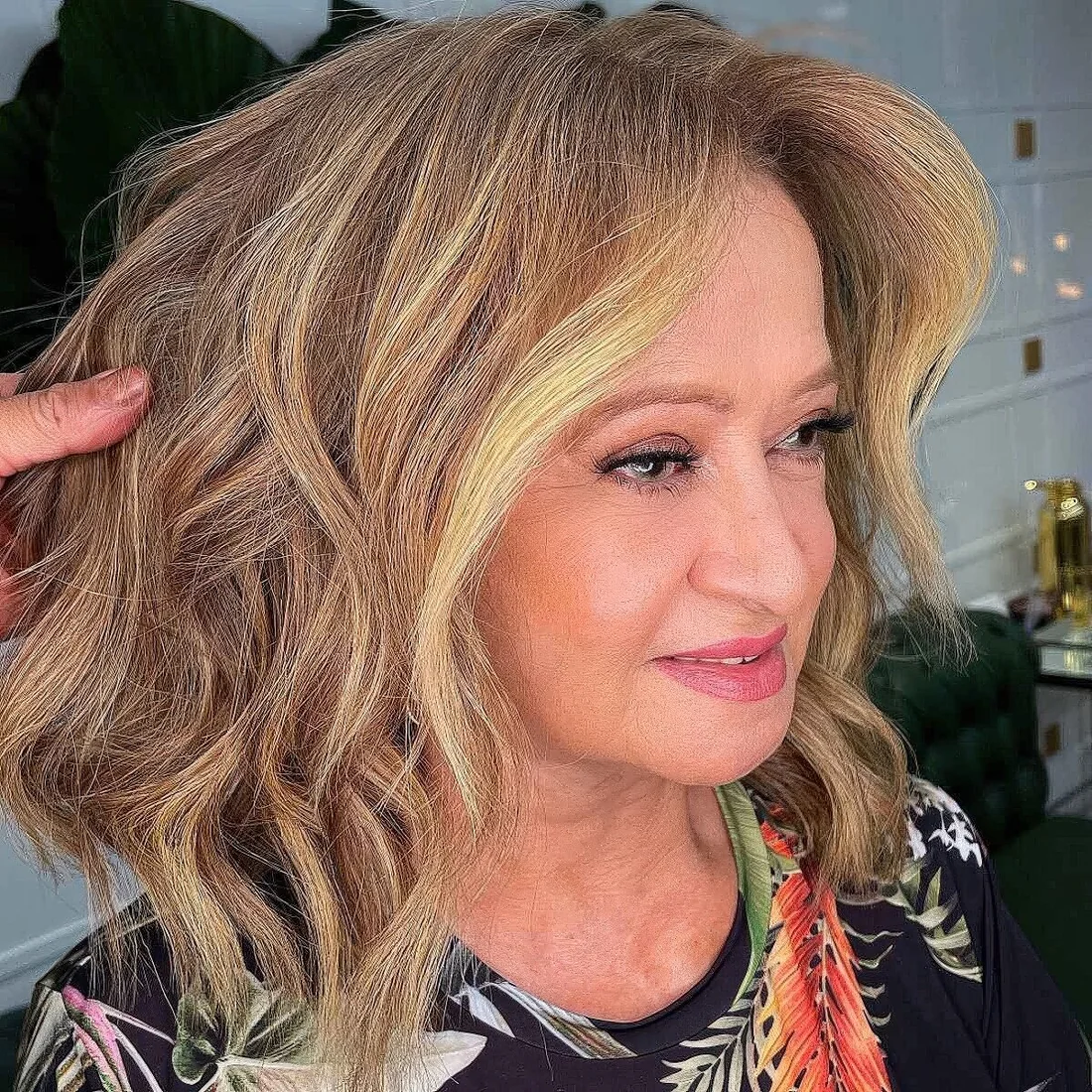 Photo showing mid length choppy haircut, with the hairstyle clearly visible.