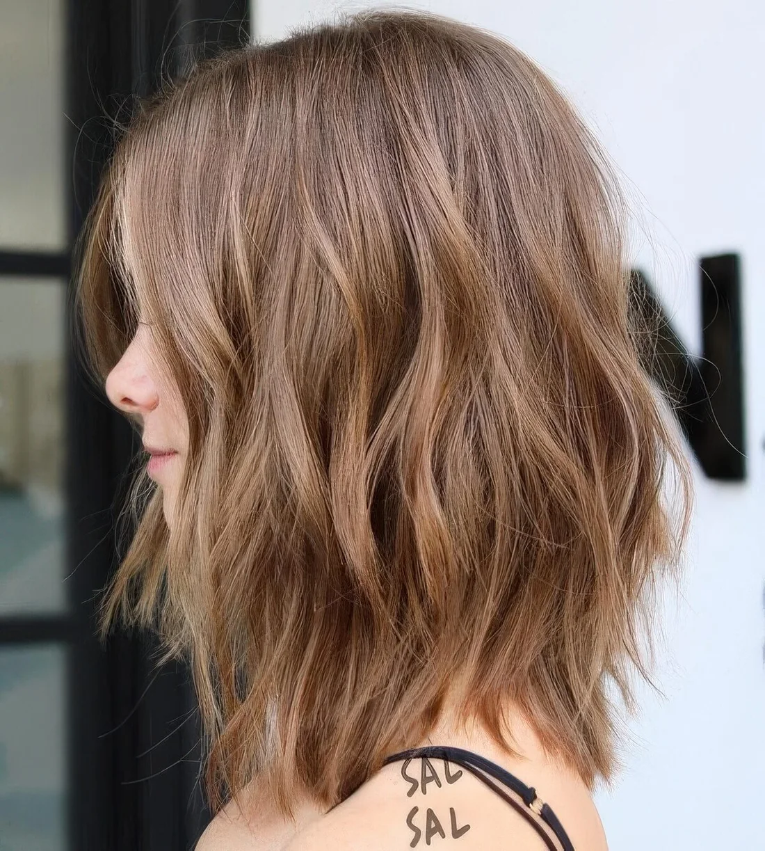 Photo showing choppy long bob, with the hairstyle clearly visible.