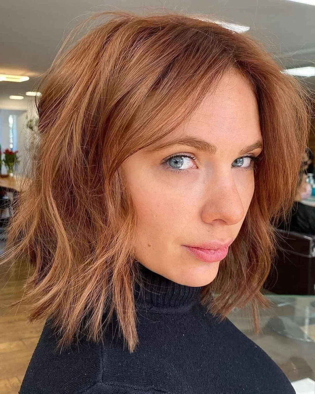 Ginger mid length chop with internal layers for fine hair.