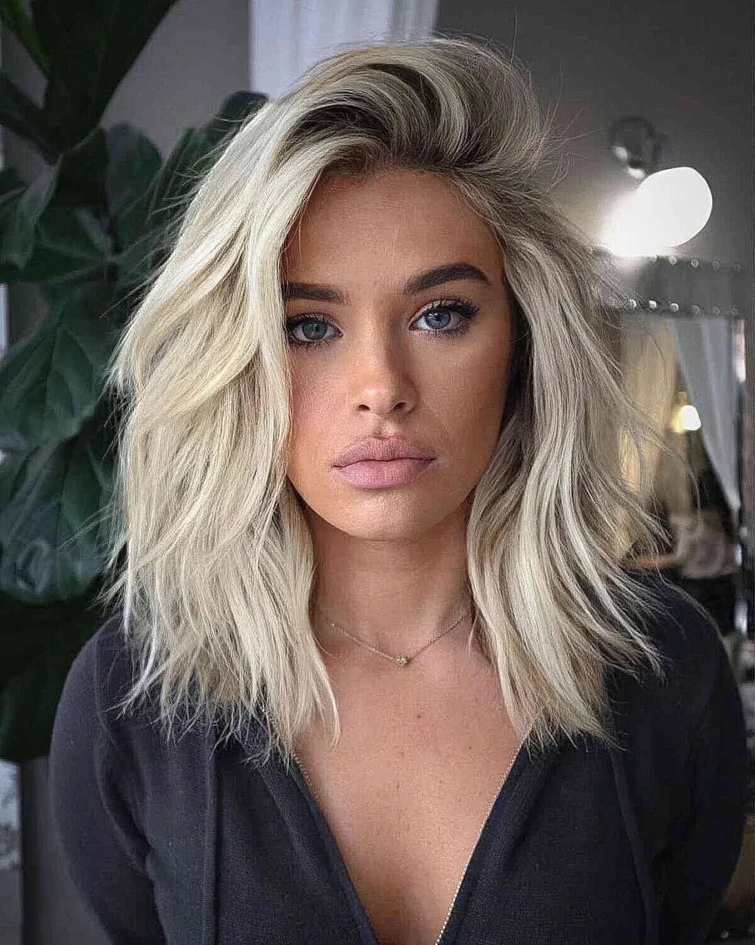 Photo showing icy blonde hairstyle, with the hairstyle clearly visible.