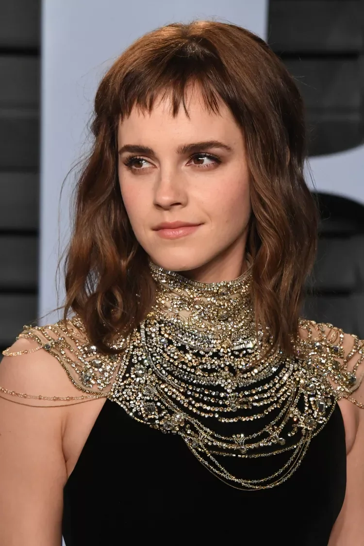 shoulder wavy brunette shag with wispy fringe shown as a medium length haircut ideas for thin fine hair idea