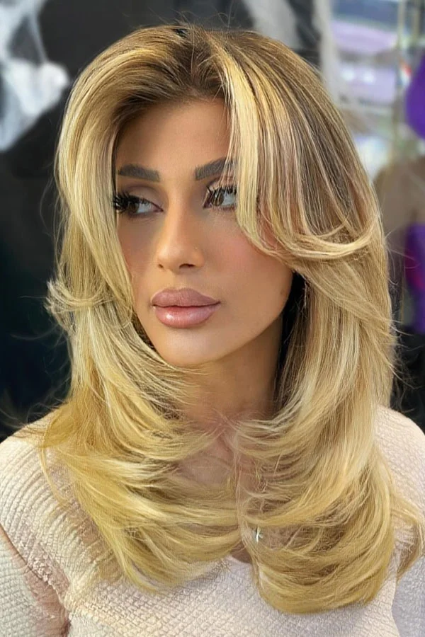 shoulder straight blonde layers with curtain fringe shown as a medium length haircut ideas for thin fine hair idea