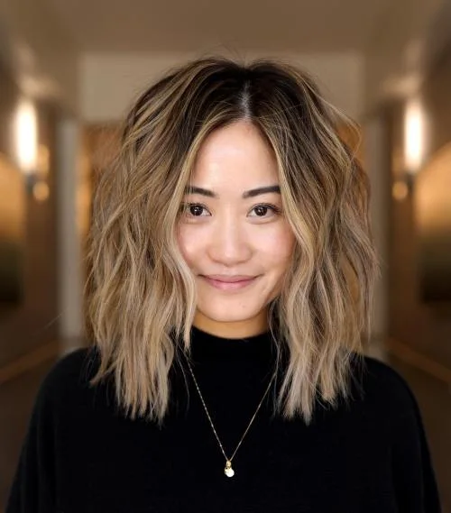 shoulder wavy honey shag with curtain fringe shown as a medium length haircut ideas for thin fine hair idea