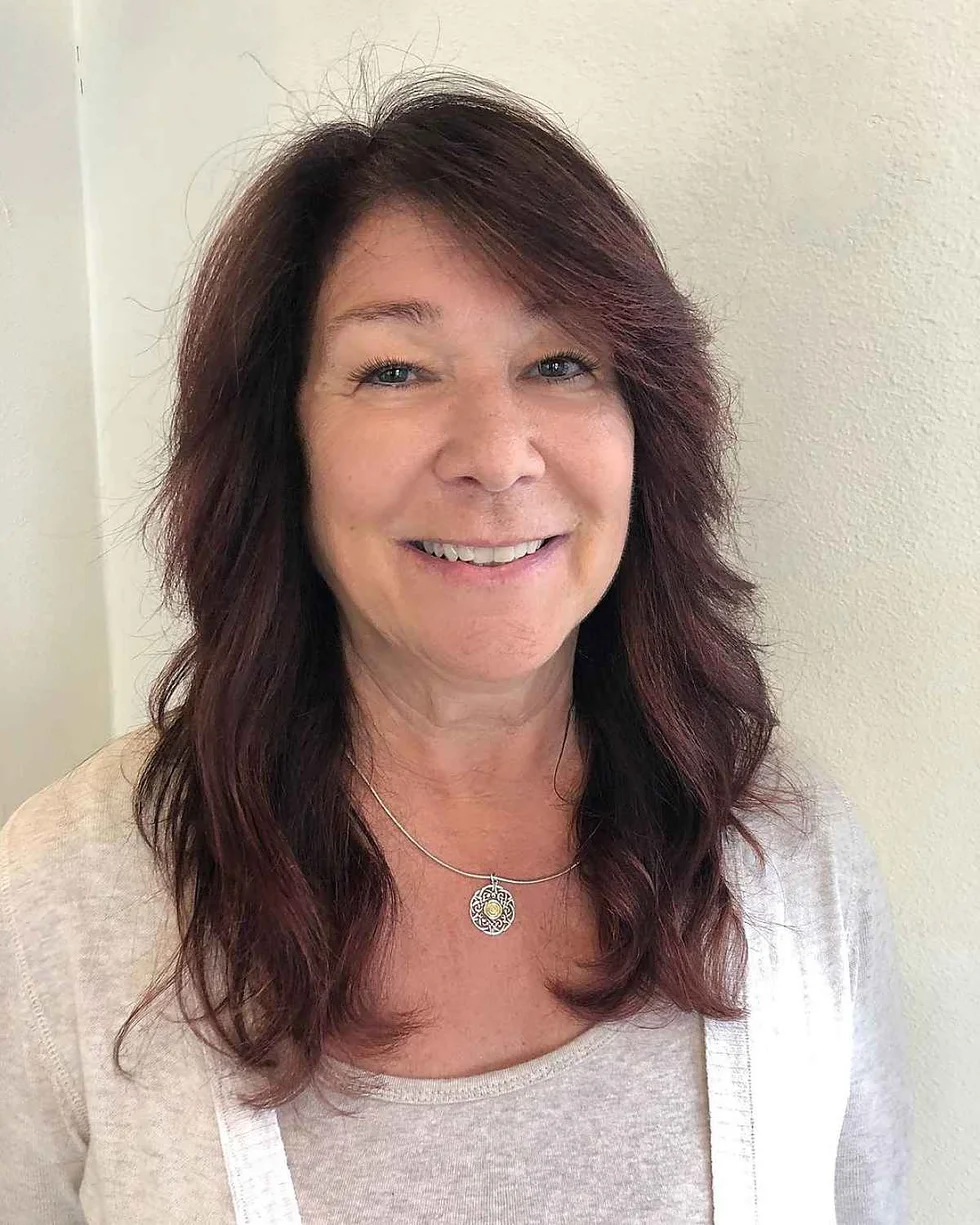 shoulder wavy brunette layers shown as a medium length haircuts for thick hair idea
